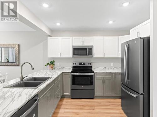 107-113 Mallard Way, Whitehorse, YT - Indoor Photo Showing Kitchen With Stainless Steel Kitchen With Double Sink With Upgraded Kitchen