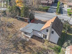 Tin Roof on Original Home, New Roof on Later Addition - 