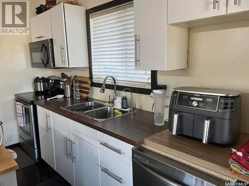 619 1St Street E, Meadow Lake, SK - Indoor Photo Showing Kitchen With Double Sink