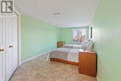 101 - 9 Pine Street, Lambton Shores (Grand Bend), ON - Indoor Photo Showing Bedroom