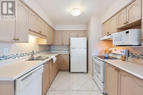 101 - 9 Pine Street, Lambton Shores (Grand Bend), ON - Indoor Photo Showing Kitchen With Double Sink