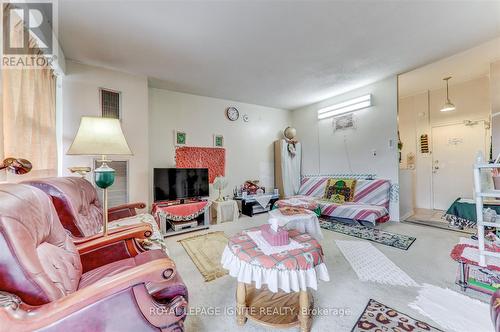 505 - 4060 Lawrence Avenue E, Toronto, ON - Indoor Photo Showing Living Room With Fireplace