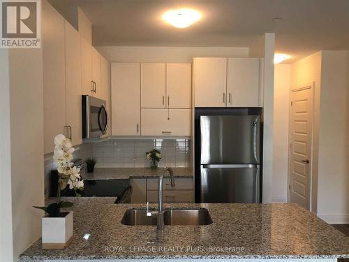 238 - 102 Grovewood Common Circle, Oakville, ON - Indoor Photo Showing Kitchen With Stainless Steel Kitchen With Double Sink With Upgraded Kitchen