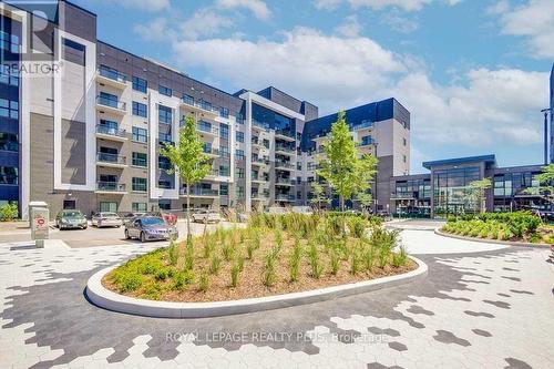 238 - 102 Grovewood Common Circle, Oakville, ON - Outdoor With Balcony With Facade