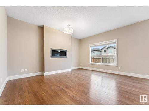 3915 Agar Co Sw, Edmonton, AB - Indoor Photo Showing Living Room With Fireplace