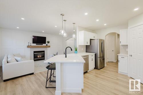 420 84 St Sw, Edmonton, AB - Indoor Photo Showing Kitchen With Fireplace With Upgraded Kitchen