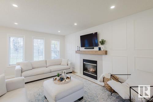 420 84 St Sw, Edmonton, AB - Indoor Photo Showing Living Room With Fireplace