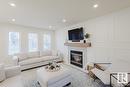 420 84 St Sw, Edmonton, AB  - Indoor Photo Showing Living Room With Fireplace 