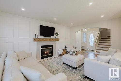 420 84 St Sw, Edmonton, AB - Indoor Photo Showing Living Room With Fireplace