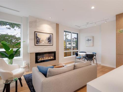 211-1201 Fort St, Victoria, BC - Indoor Photo Showing Living Room With Fireplace