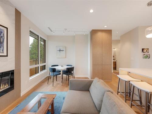 211-1201 Fort St, Victoria, BC - Indoor Photo Showing Living Room With Fireplace