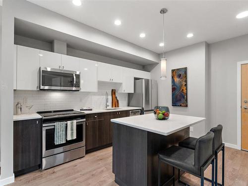 204-767 Tyee Rd, Victoria, BC - Indoor Photo Showing Kitchen With Stainless Steel Kitchen With Upgraded Kitchen