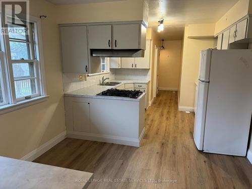 Mainflr - 508 Walkers Line, Burlington, ON - Indoor Photo Showing Kitchen With Double Sink