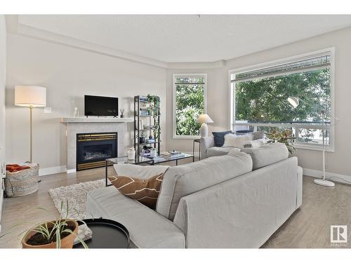 #203 8108 109 St Nw, Edmonton, AB - Indoor Photo Showing Living Room With Fireplace