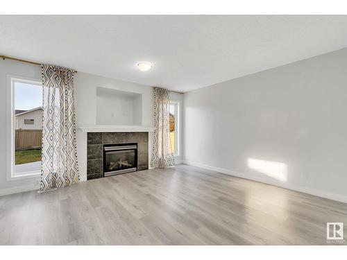 514 89 St Sw, Edmonton, AB - Indoor Photo Showing Living Room With Fireplace