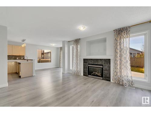 514 89 St Sw, Edmonton, AB - Indoor Photo Showing Living Room With Fireplace