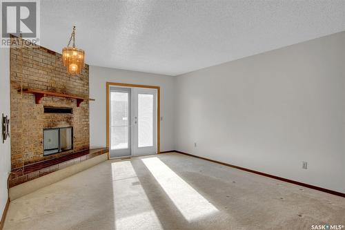 7227 Sherwood Drive, Regina, SK - Indoor Photo Showing Other Room With Fireplace