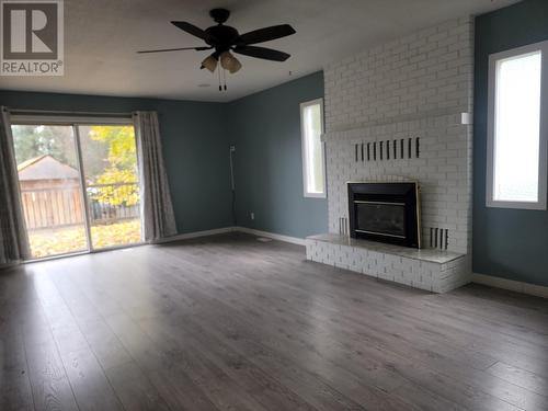 550 Palmer Street, Quesnel, BC - Indoor Photo Showing Living Room With Fireplace