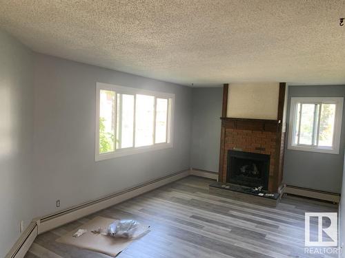 10826 113 St Nw, Edmonton, AB - Indoor Photo Showing Living Room With Fireplace