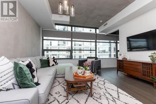 407 - 1201 Dundas Street E, Toronto, ON - Indoor Photo Showing Living Room