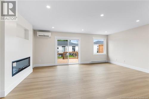 138 Ernest Street, Dieppe, NB - Indoor Photo Showing Living Room With Fireplace