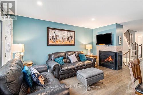 212 Purchase Crescent, Ottawa, ON - Indoor Photo Showing Living Room With Fireplace