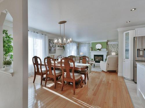 Overall view - 26 Rue Amireault, L'Épiphanie, QC - Indoor Photo Showing Dining Room With Fireplace