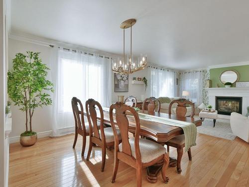 Dining room - 26 Rue Amireault, L'Épiphanie, QC - Indoor Photo Showing Dining Room With Fireplace