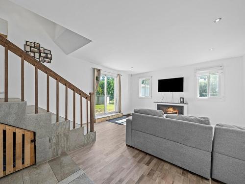 Living room - 90 Rue Jean, Drummondville, QC - Indoor Photo Showing Other Room With Fireplace