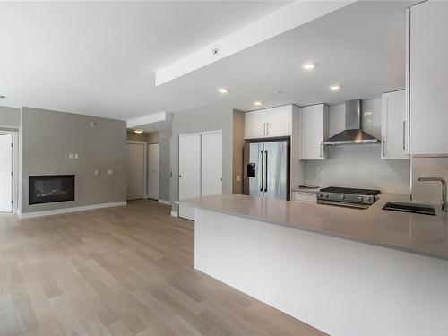 307-3529 Dolphin Dr, Nanoose Bay, BC - Indoor Photo Showing Kitchen With Fireplace With Upgraded Kitchen