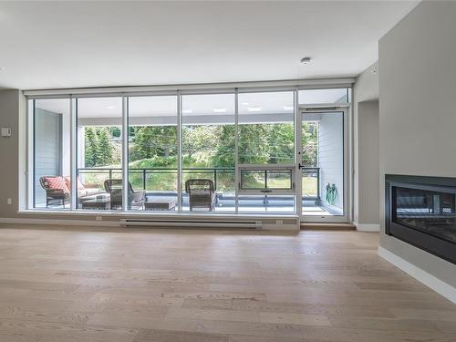 307-3529 Dolphin Dr, Nanoose Bay, BC - Indoor Photo Showing Living Room With Fireplace