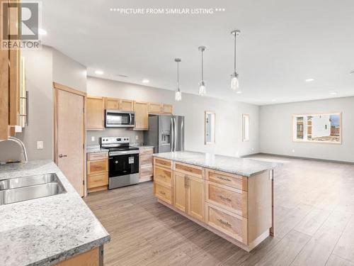 16 Flora Avenue, Whitehorse, YT - Indoor Photo Showing Kitchen With Double Sink