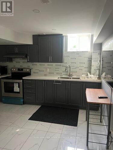 Bsmt - 12 Yellowknife Road, Brampton, ON - Indoor Photo Showing Kitchen With Double Sink