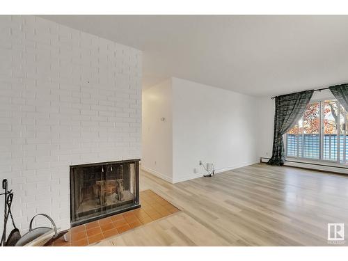 #5 10836 116 St Nw, Edmonton, AB - Indoor Photo Showing Living Room With Fireplace