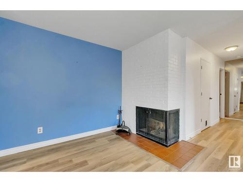 #5 10836 116 St Nw, Edmonton, AB - Indoor Photo Showing Living Room With Fireplace