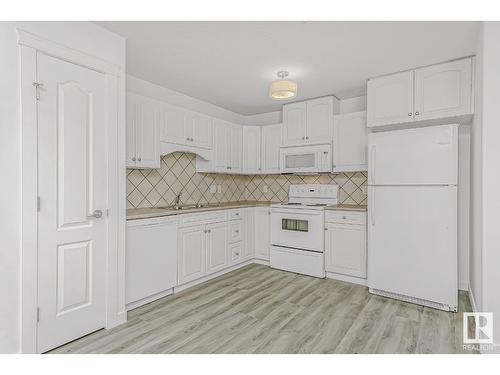 #216 261 Youville E Nw, Edmonton, AB - Indoor Photo Showing Kitchen With Double Sink