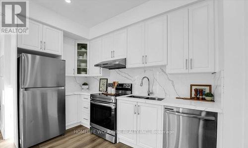 125 - 3050 Erin Centre Boulevard, Mississauga, ON - Indoor Photo Showing Kitchen With Double Sink