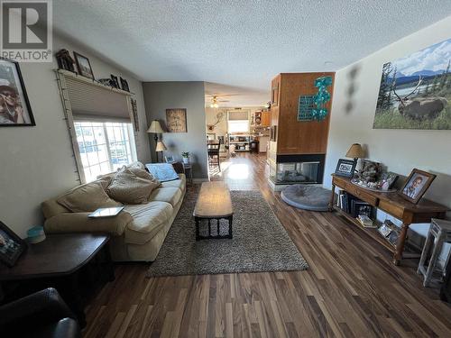 27 Pioneer Way, Fort Nelson, BC - Indoor Photo Showing Living Room With Fireplace