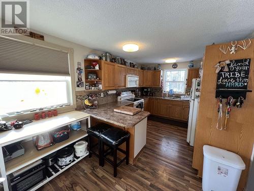 27 Pioneer Way, Fort Nelson, BC - Indoor Photo Showing Kitchen With Double Sink