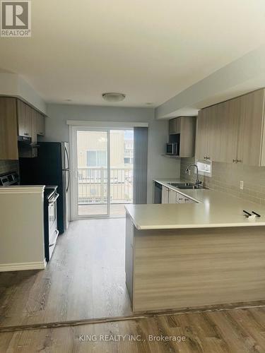 90 - 2500 Hill Rise Court, Oshawa, ON - Indoor Photo Showing Kitchen With Double Sink