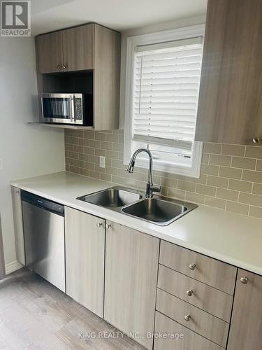 90 - 2500 Hill Rise Court, Oshawa, ON - Indoor Photo Showing Kitchen With Double Sink