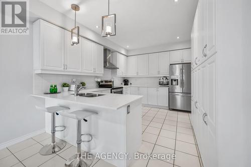 276 Fasken Court, Milton, ON - Indoor Photo Showing Kitchen With Double Sink