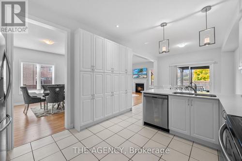 276 Fasken Court, Milton, ON - Indoor Photo Showing Kitchen With Double Sink