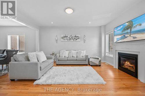 276 Fasken Court, Milton, ON - Indoor Photo Showing Living Room With Fireplace