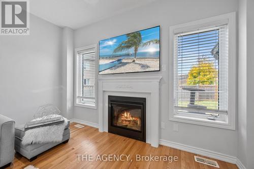 276 Fasken Court, Milton, ON - Indoor Photo Showing Living Room With Fireplace