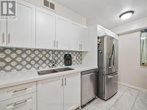 502 - 31 Four Winds Drive, Toronto, ON - Indoor Photo Showing Kitchen With Double Sink