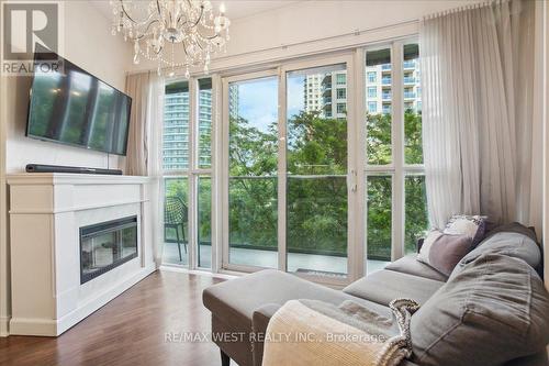 308 - 60 Absolute Avenue, Mississauga, ON - Indoor Photo Showing Living Room With Fireplace