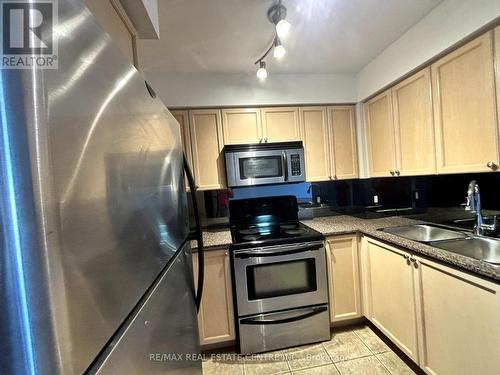 711 - 4080 Living Arts Drive, Mississauga, ON - Indoor Photo Showing Kitchen With Double Sink