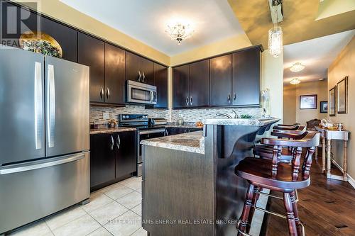 202 - 395 Lakebreeze Drive, Clarington (Newcastle), ON - Indoor Photo Showing Kitchen With Stainless Steel Kitchen