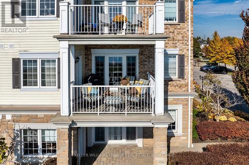 202 - 395 Lakebreeze Drive, Clarington (Newcastle), ON - Outdoor With Balcony With Facade